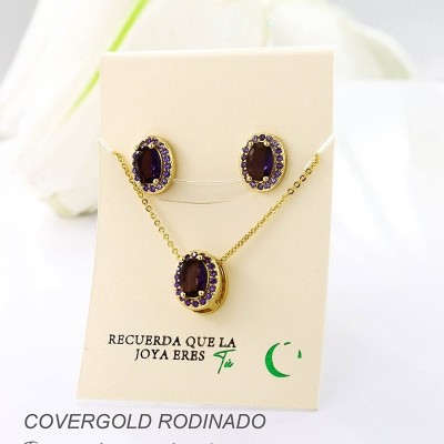 Set collar y aretes en covergold con baño en Rodio