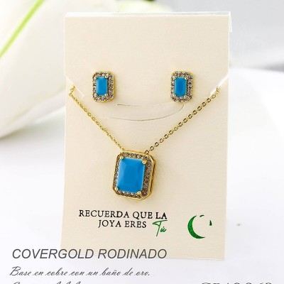 Set collar y aretes en covergold con baño en Rodio